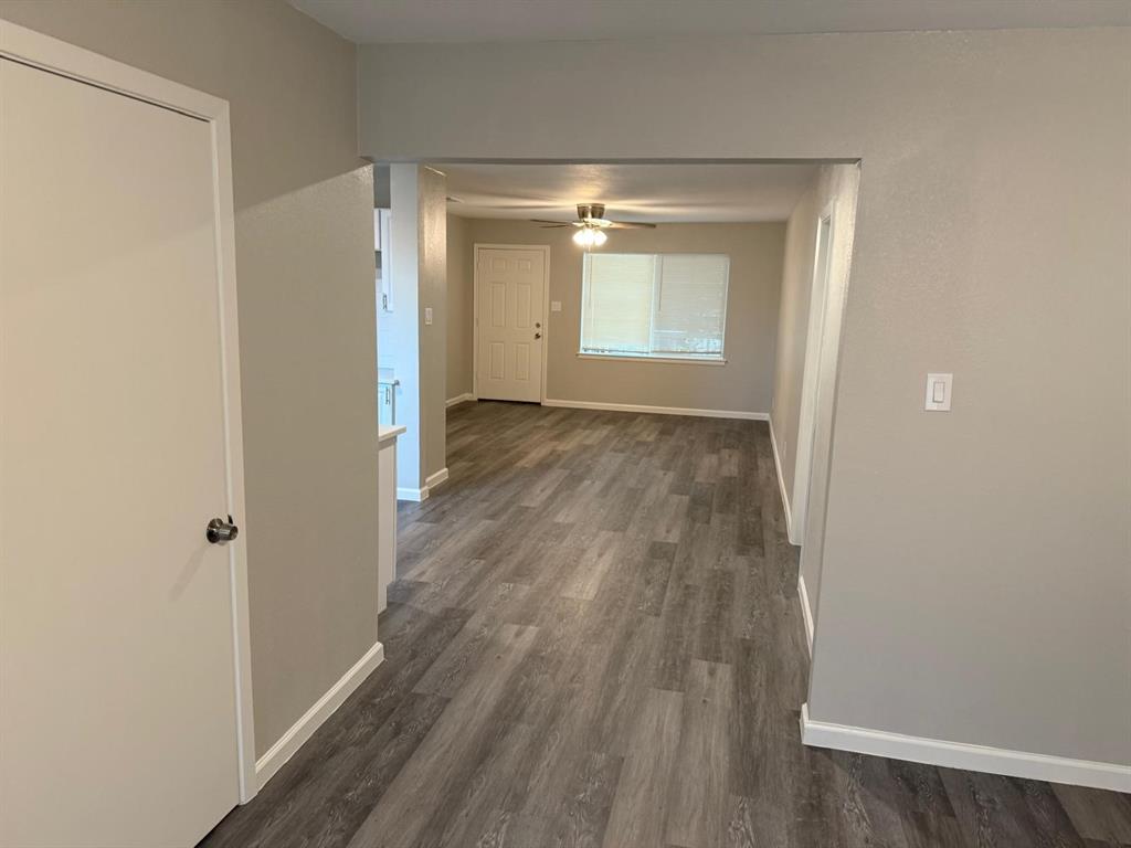 925 Bluewood Drive Dallas, TX 75232 - Photo 20 of 33 a view of empty room with wooden floor and fan