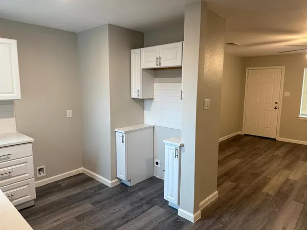 a view of kitchen with wooden floor