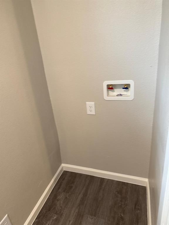 925 Bluewood Drive Dallas, TX 75232 - Photo 28 of 33 Washroom with dark wood-style floors and washer hookup