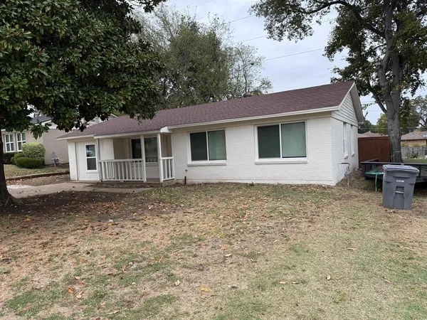 a house with trees in the background