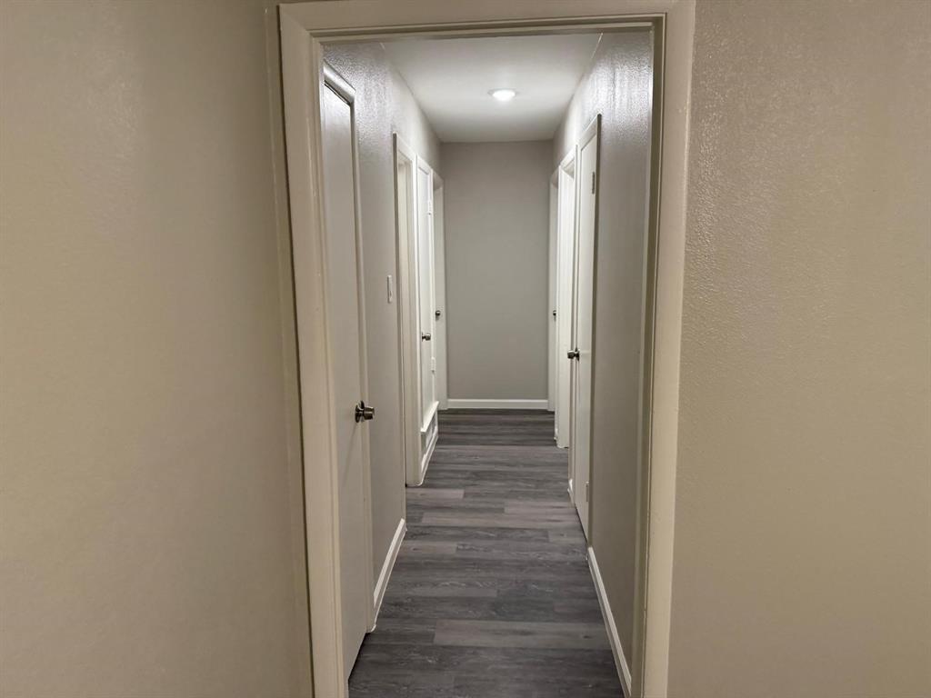 925 Bluewood Drive Dallas, TX 75232 - Photo 10 of 33 a view of staircase with wooden floor