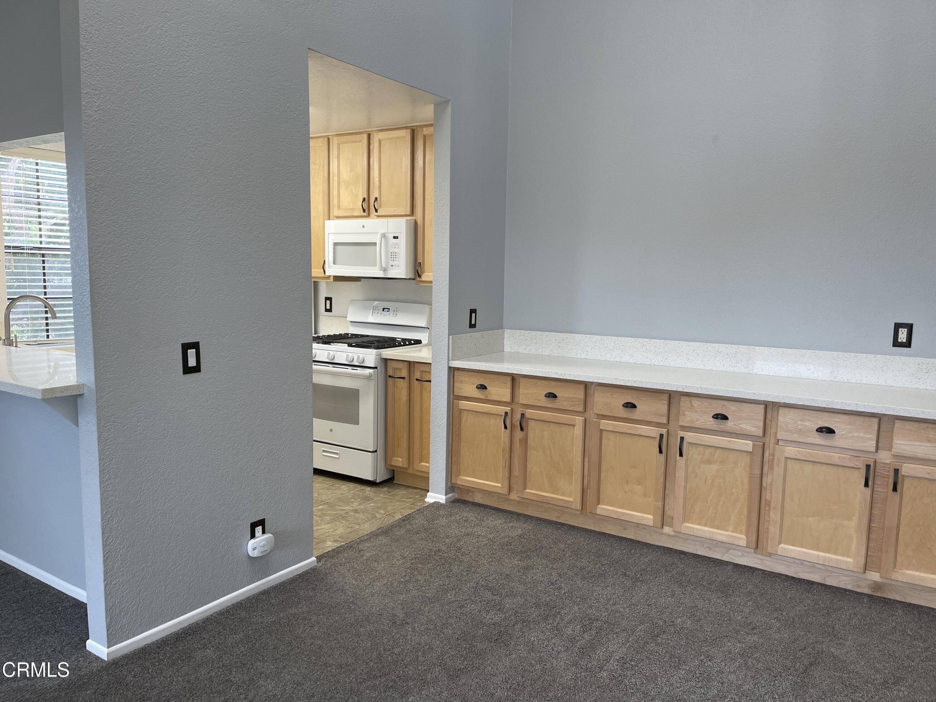 2257 Martinique Lane Oxnard, CA 93035 - Photo 13 of 52 a view of a kitchen with electric equipment