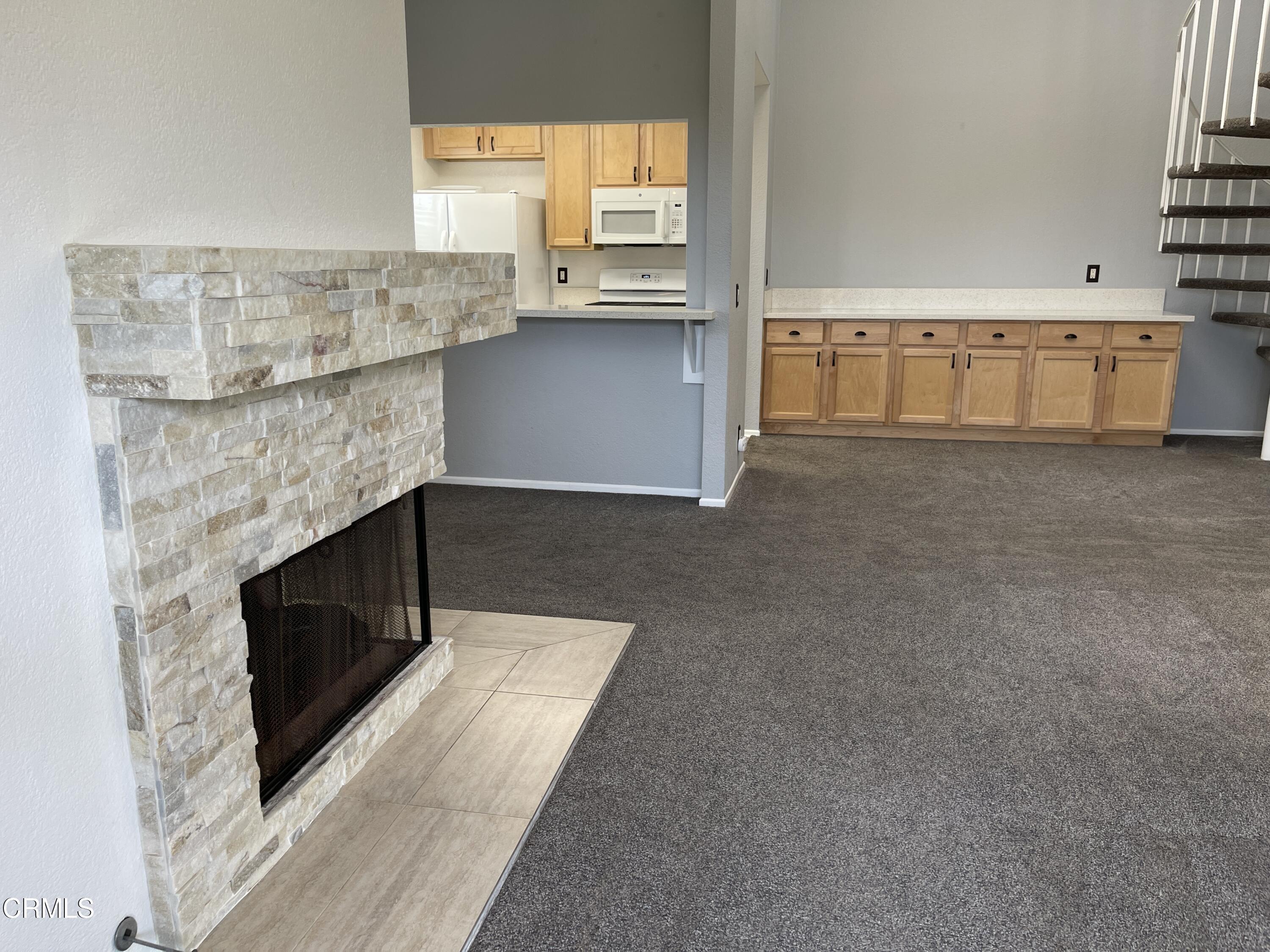 2257 Martinique Lane Oxnard, CA 93035 - Photo 20 of 52 a living room with stainless steel appliances wooden floor and view living room
