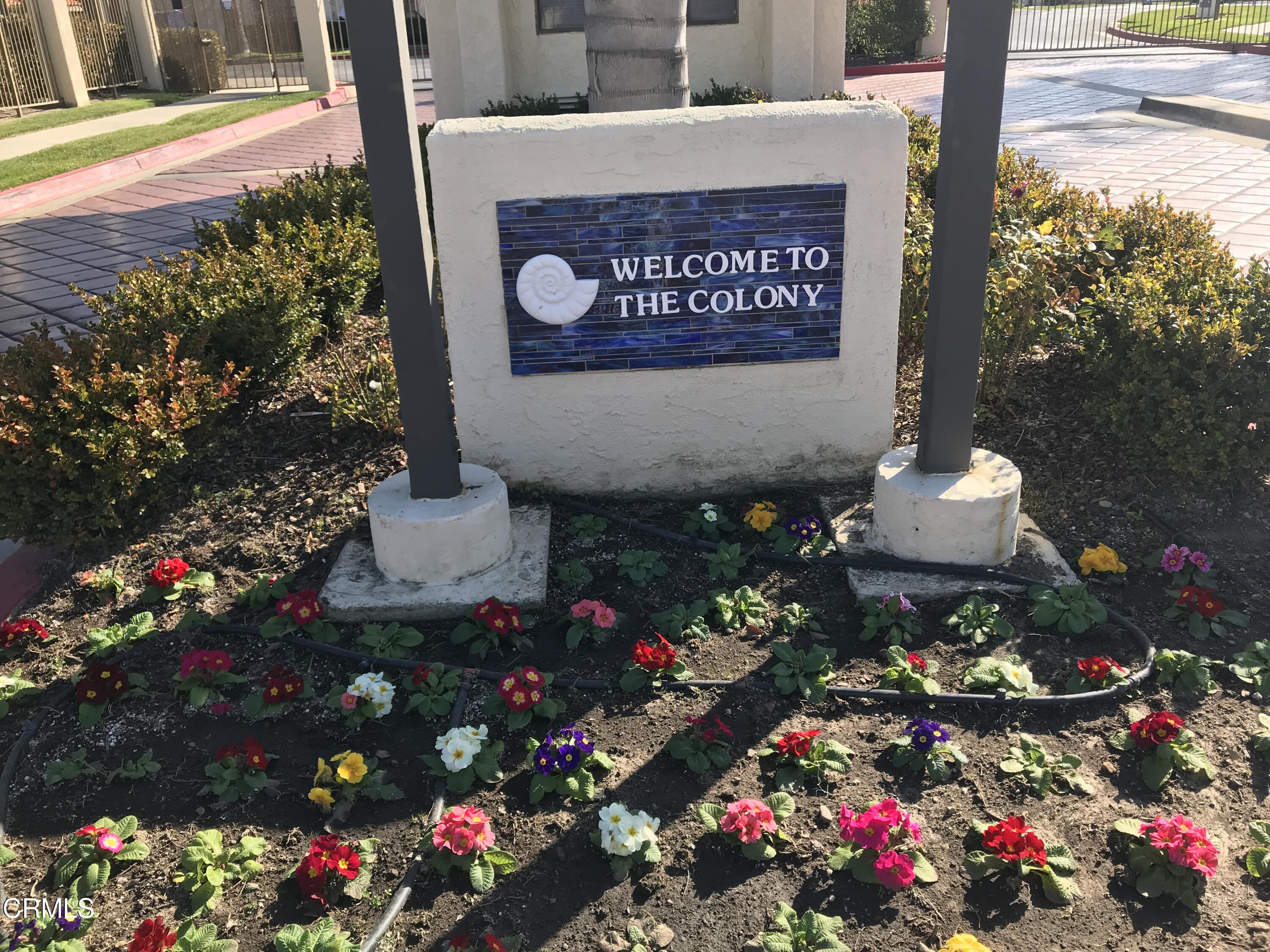 2257 Martinique Lane Oxnard, CA 93035 - Photo 3 of 52 a sign that is in front of flowers