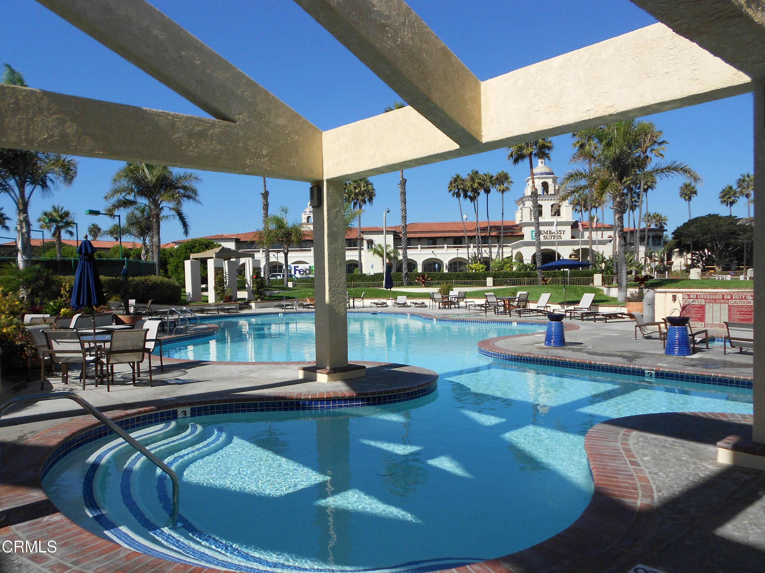 2257 Martinique Lane Oxnard, CA 93035 - Photo 38 of 52 a view of a swimming pool with outdoor seating