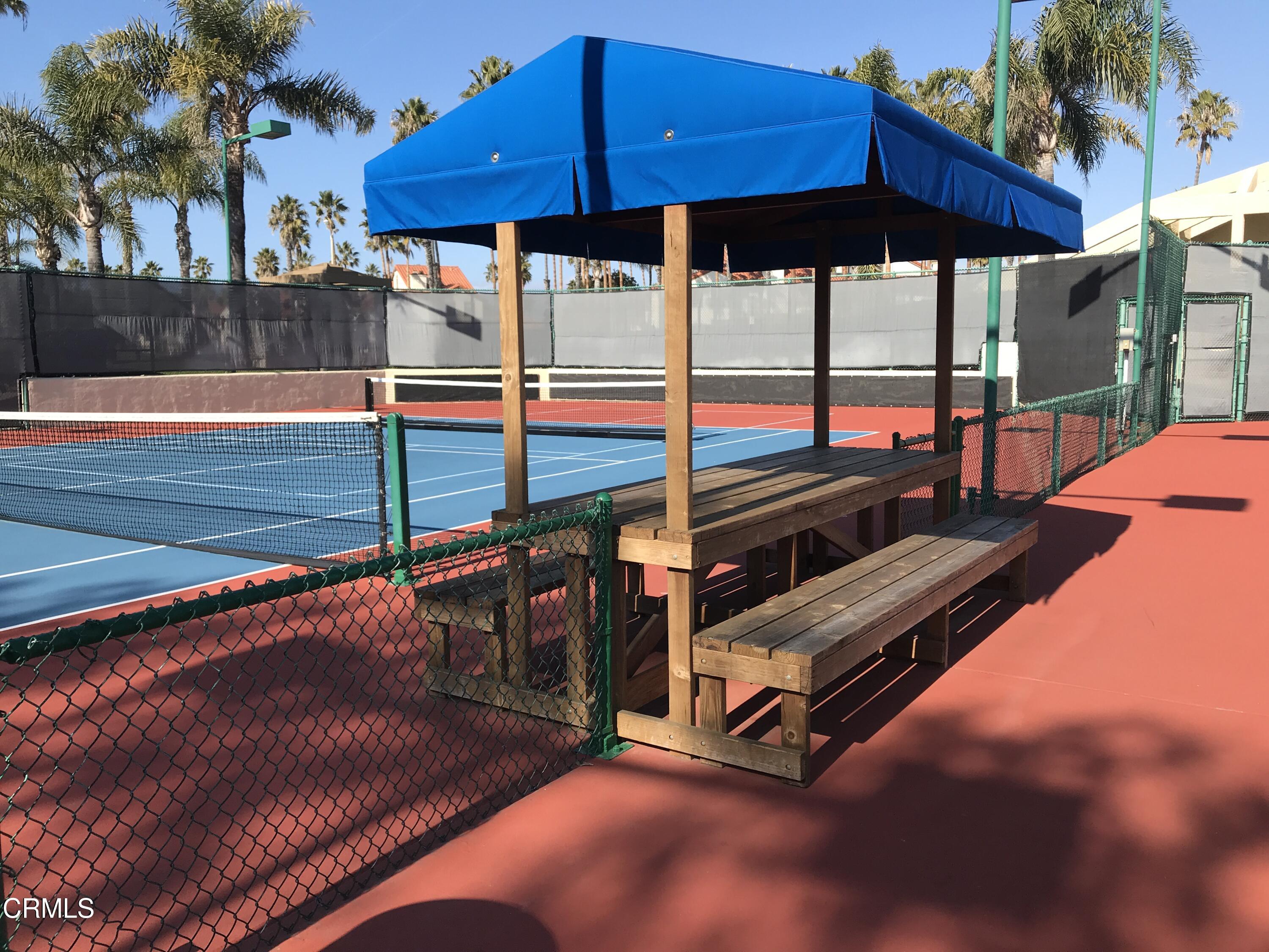 2257 Martinique Lane Oxnard, CA 93035 - Photo 41 of 52 a view of a swimming pool with a lounge chairs