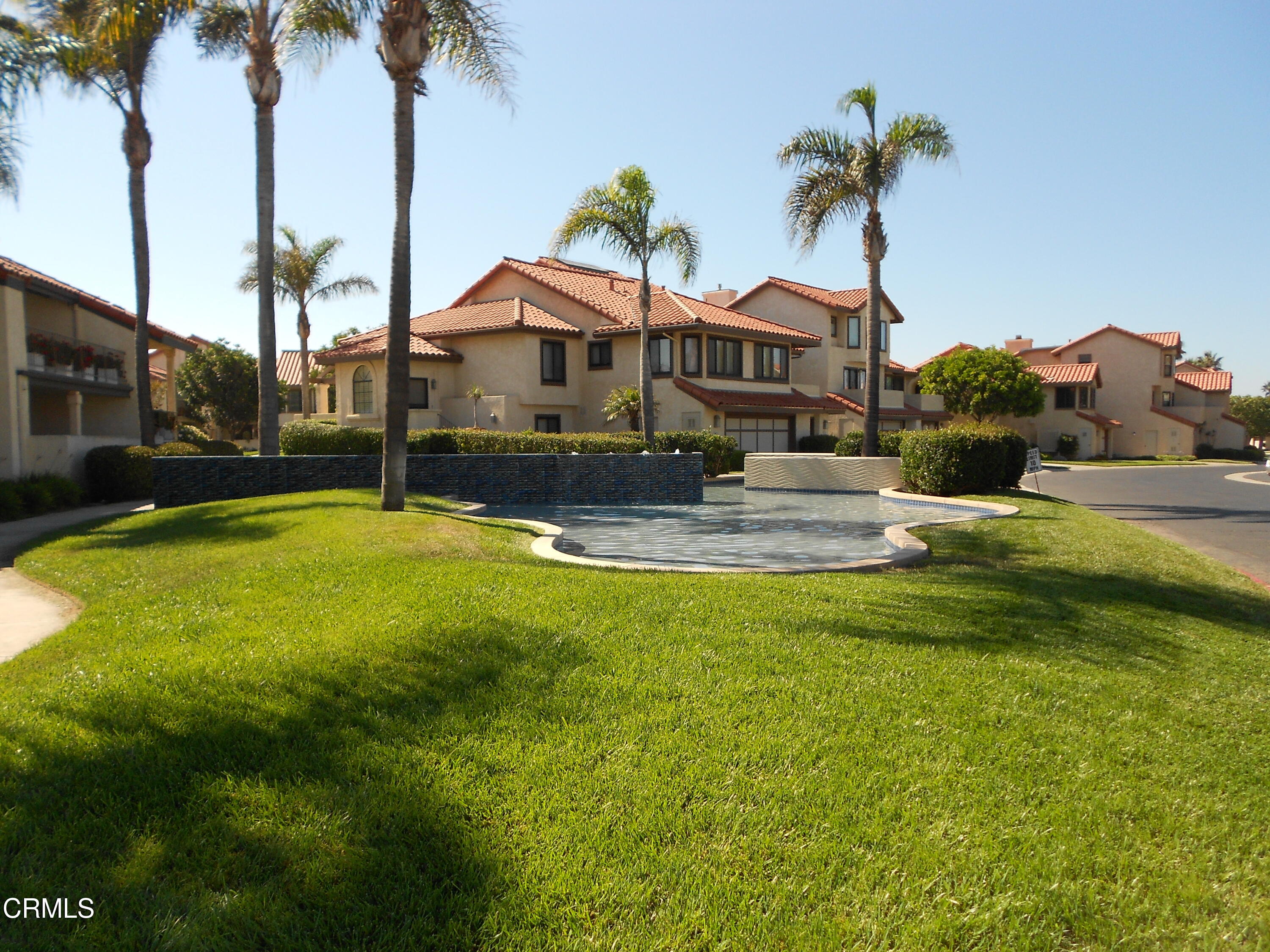 2257 Martinique Lane Oxnard, CA 93035 - Photo 43 of 52 a front view of house with yard and swimming pool