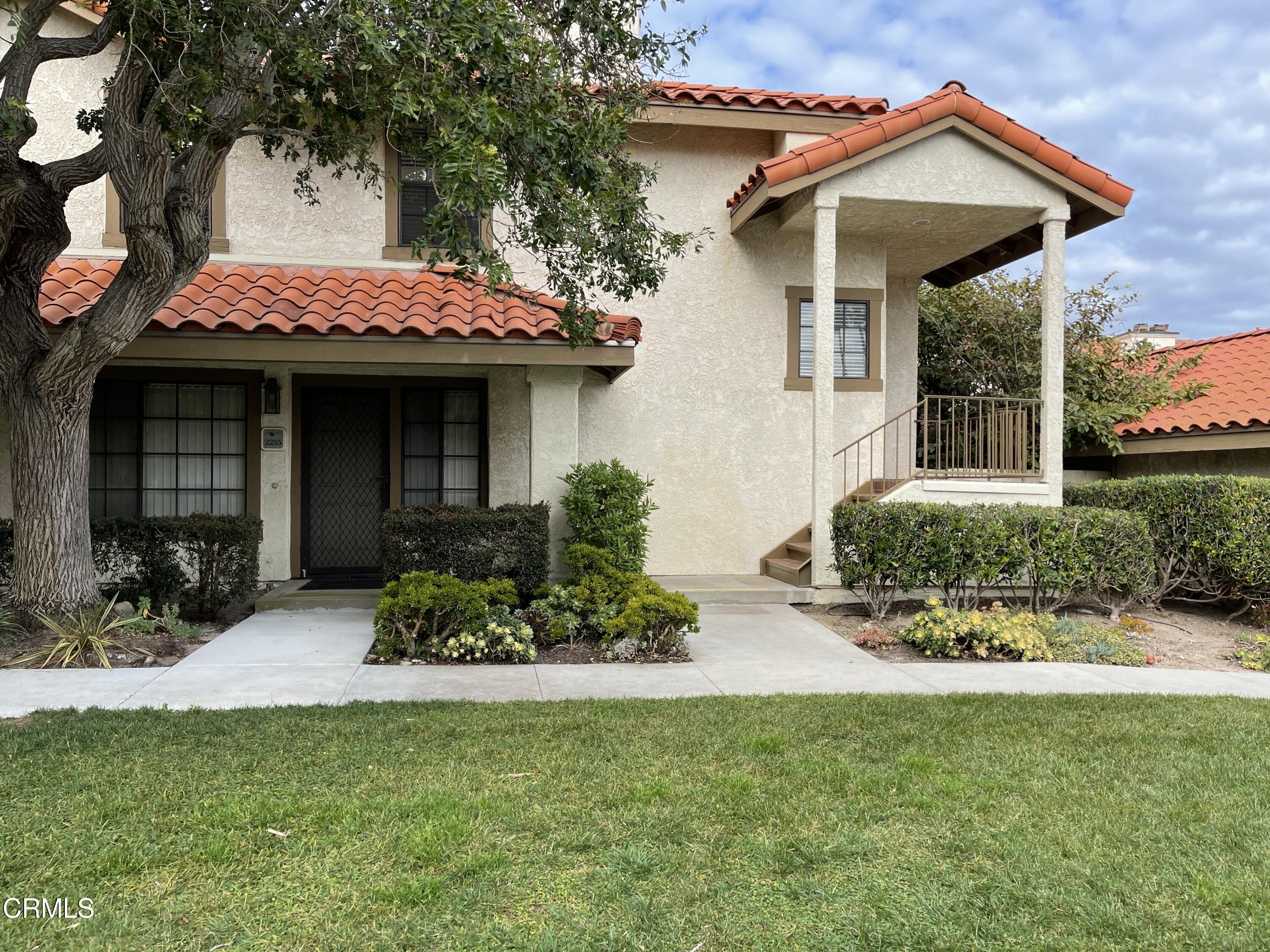 2257 Martinique Lane Oxnard, CA 93035 - Photo 5 of 52 a view of a house with a yard and potted plants