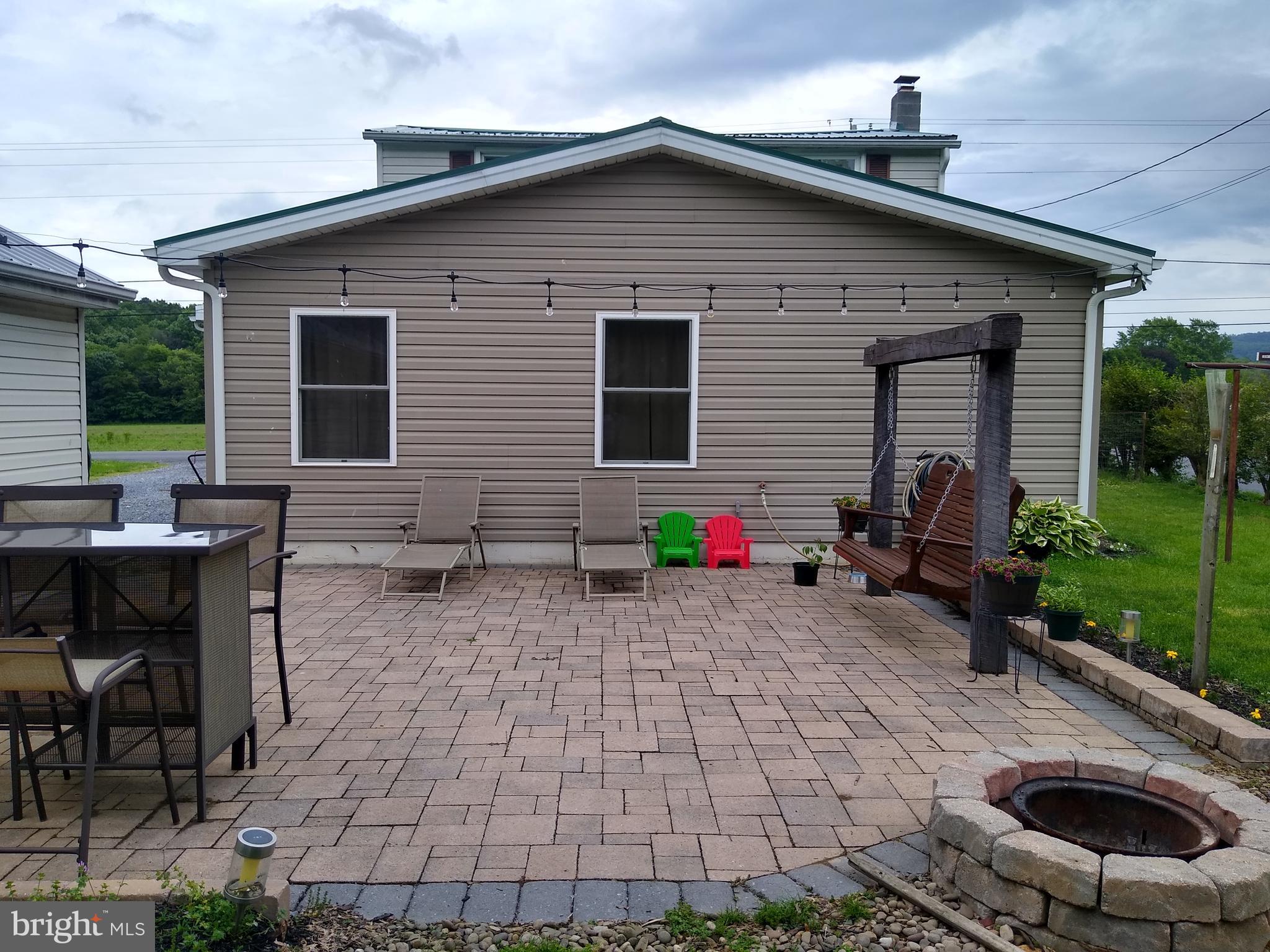 128 Neil Road Shippensburg, PA 17257 - Photo 4 of 15 Large paved patio with fire pit