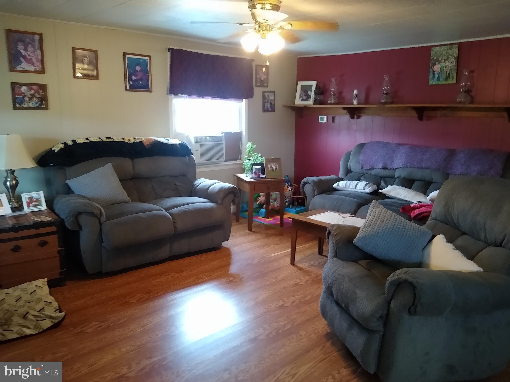128 Neil Road Shippensburg, PA 17257 - Photo 7 of 15 Large living room with laminate flooring