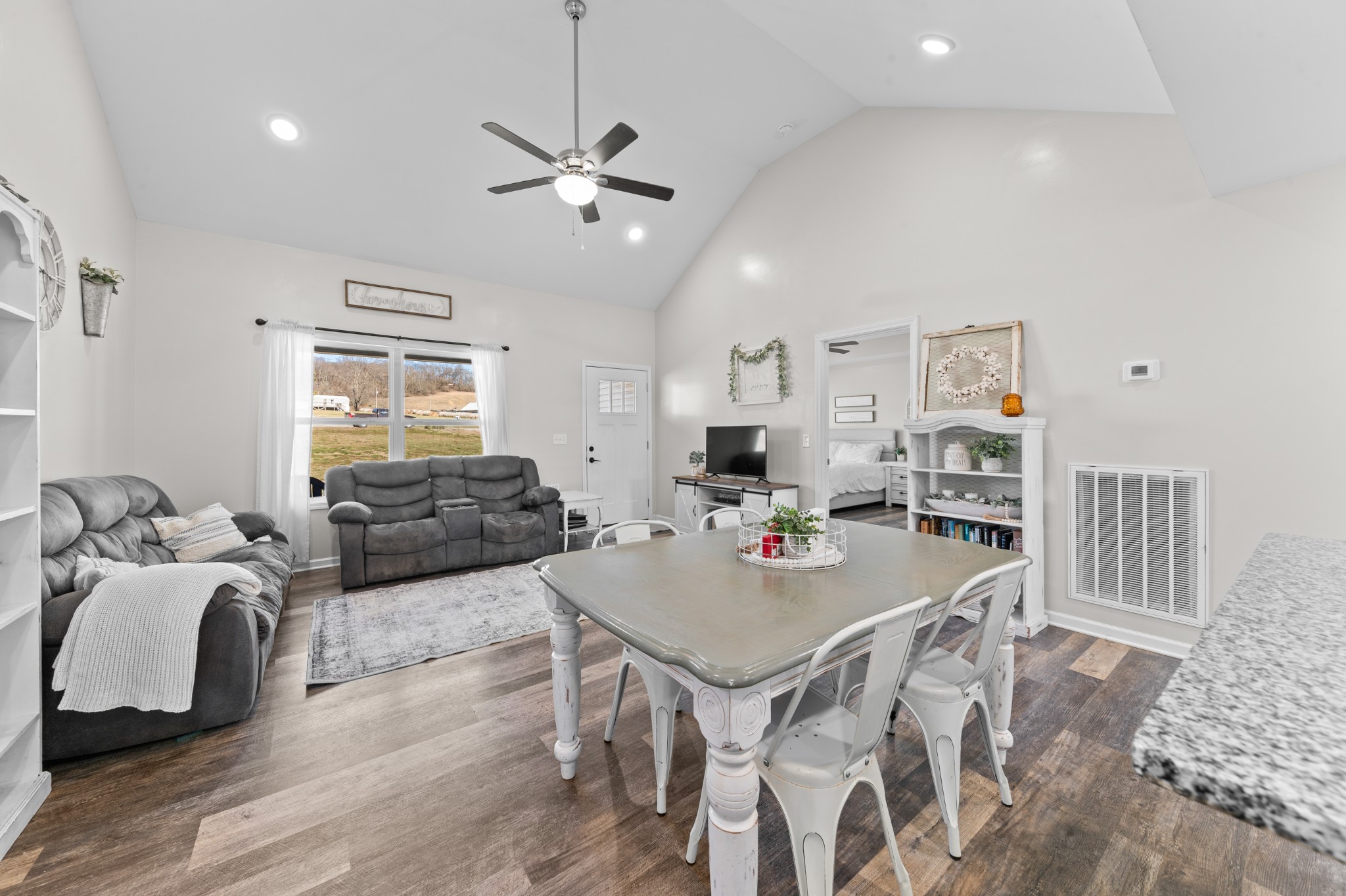 2023 Coleman Road Cornersville, TN 37047 - Photo 15 of 80 a living room with furniture a two couches and a dining table with wooden floor