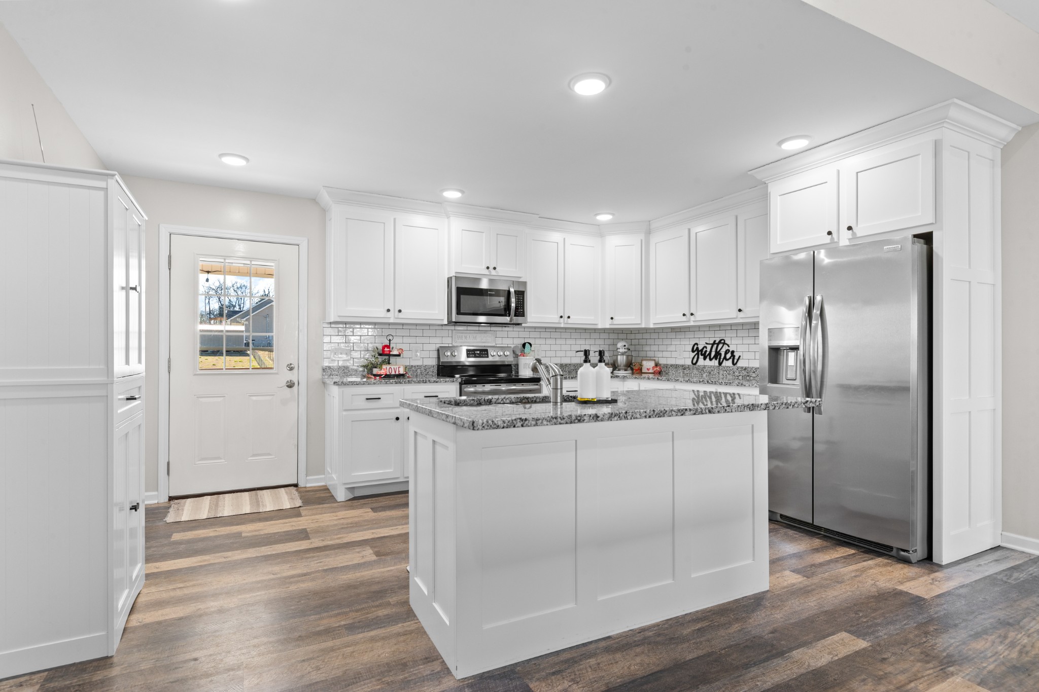 2023 Coleman Road Cornersville, TN 37047 - Photo 17 of 80 a kitchen with stainless steel appliances granite countertop a refrigerator and a stove top oven