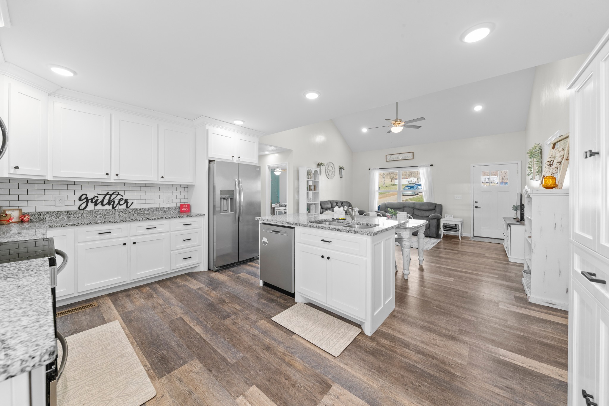 2023 Coleman Road Cornersville, TN 37047 - Photo 24 of 80 a kitchen with white cabinets and white appliances