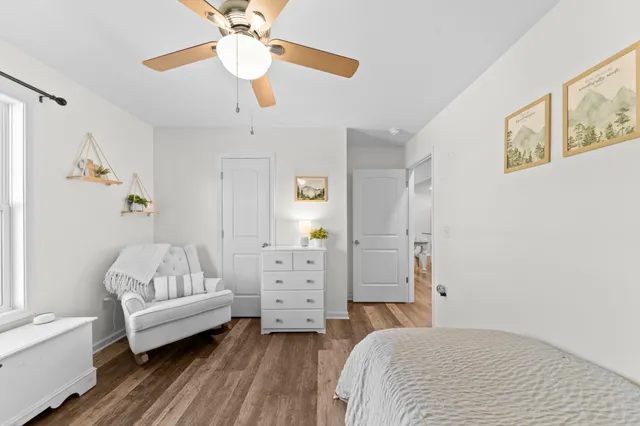 a view of a house with wooden deck and furniture