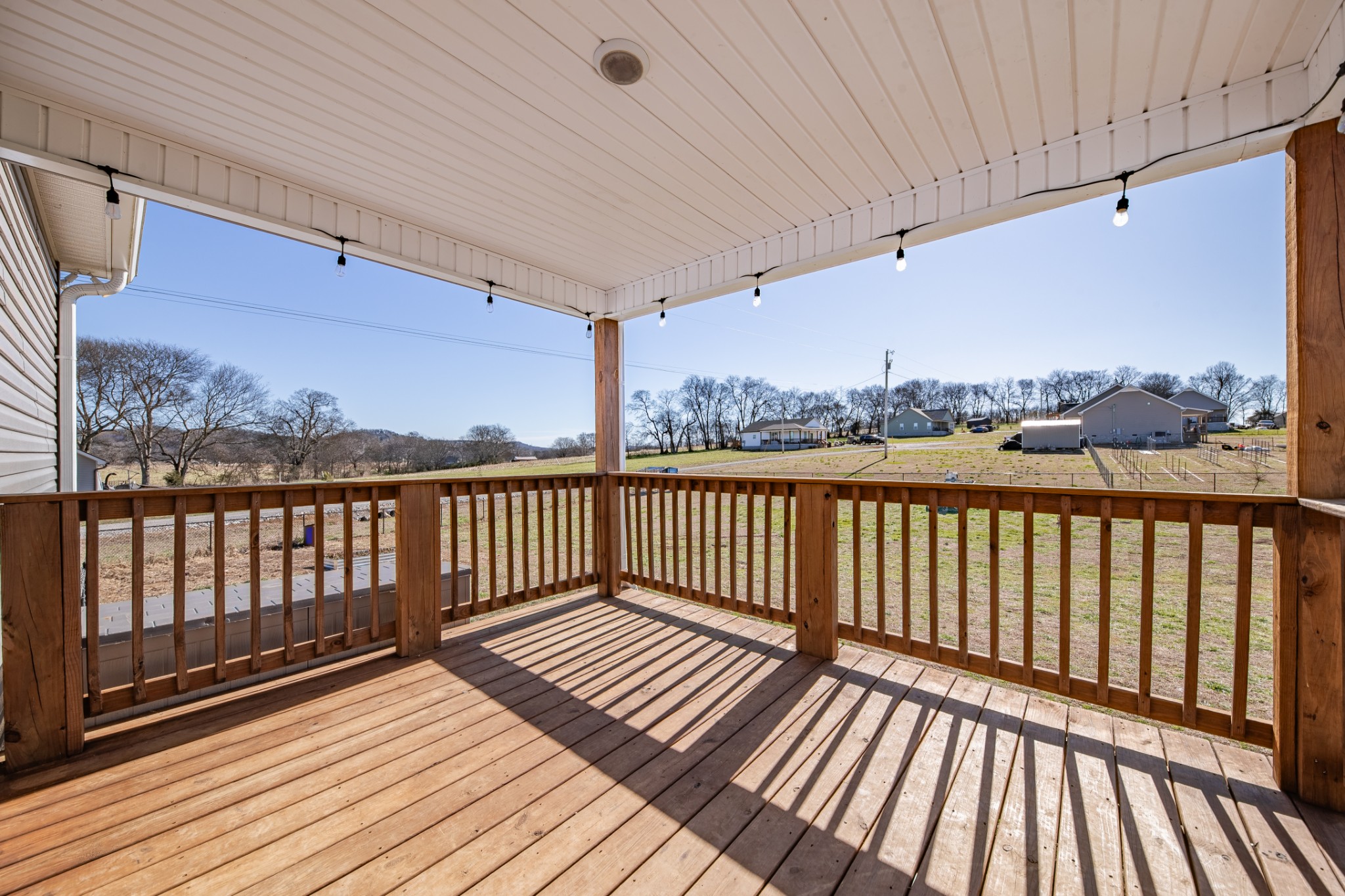 2023 Coleman Road Cornersville, TN 37047 - Photo 46 of 80 a view of balcony with wooden floor