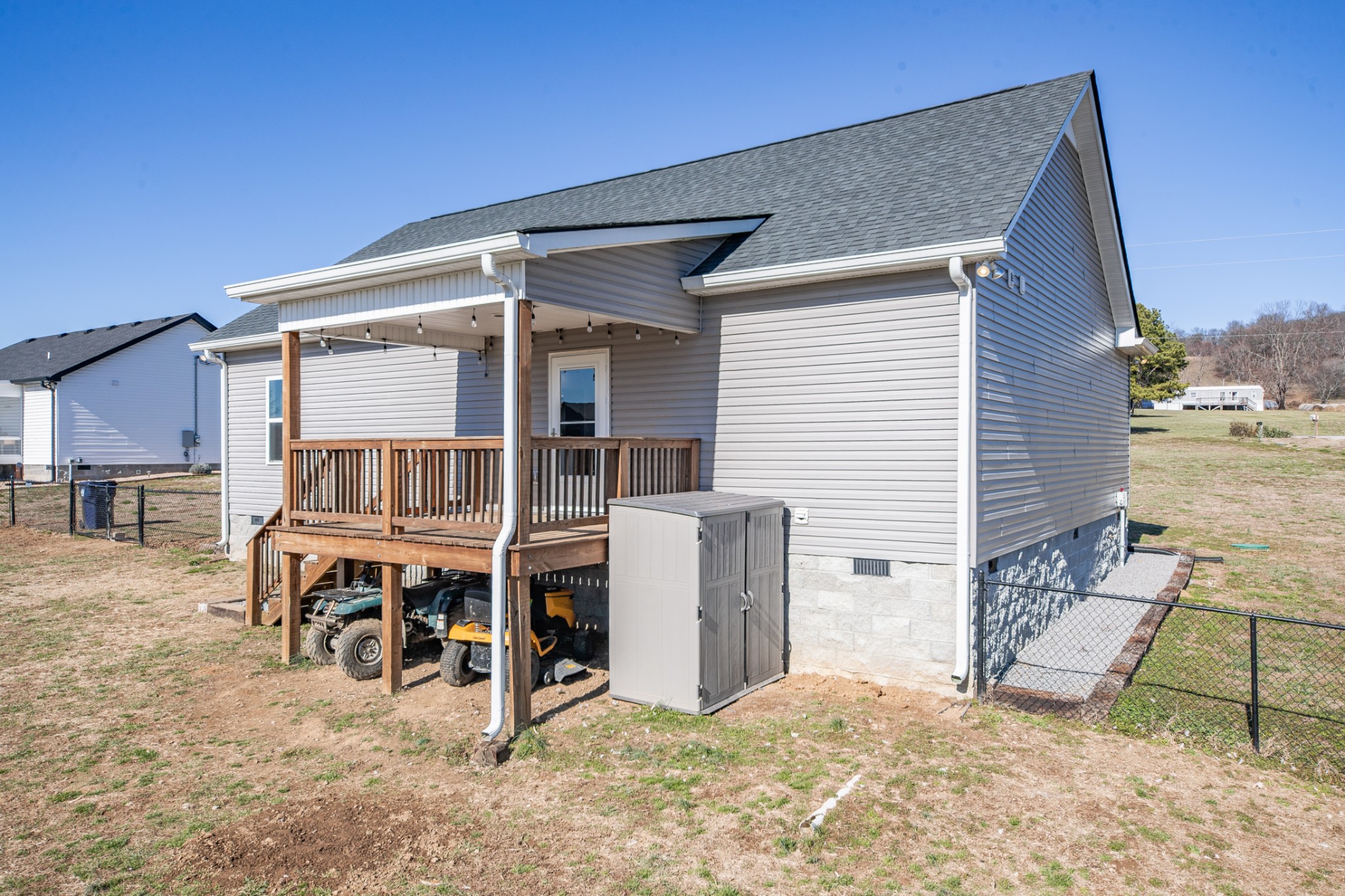 2023 Coleman Road Cornersville, TN 37047 - Photo 49 of 80 a backyard of a house with barbeque oven table and chairs