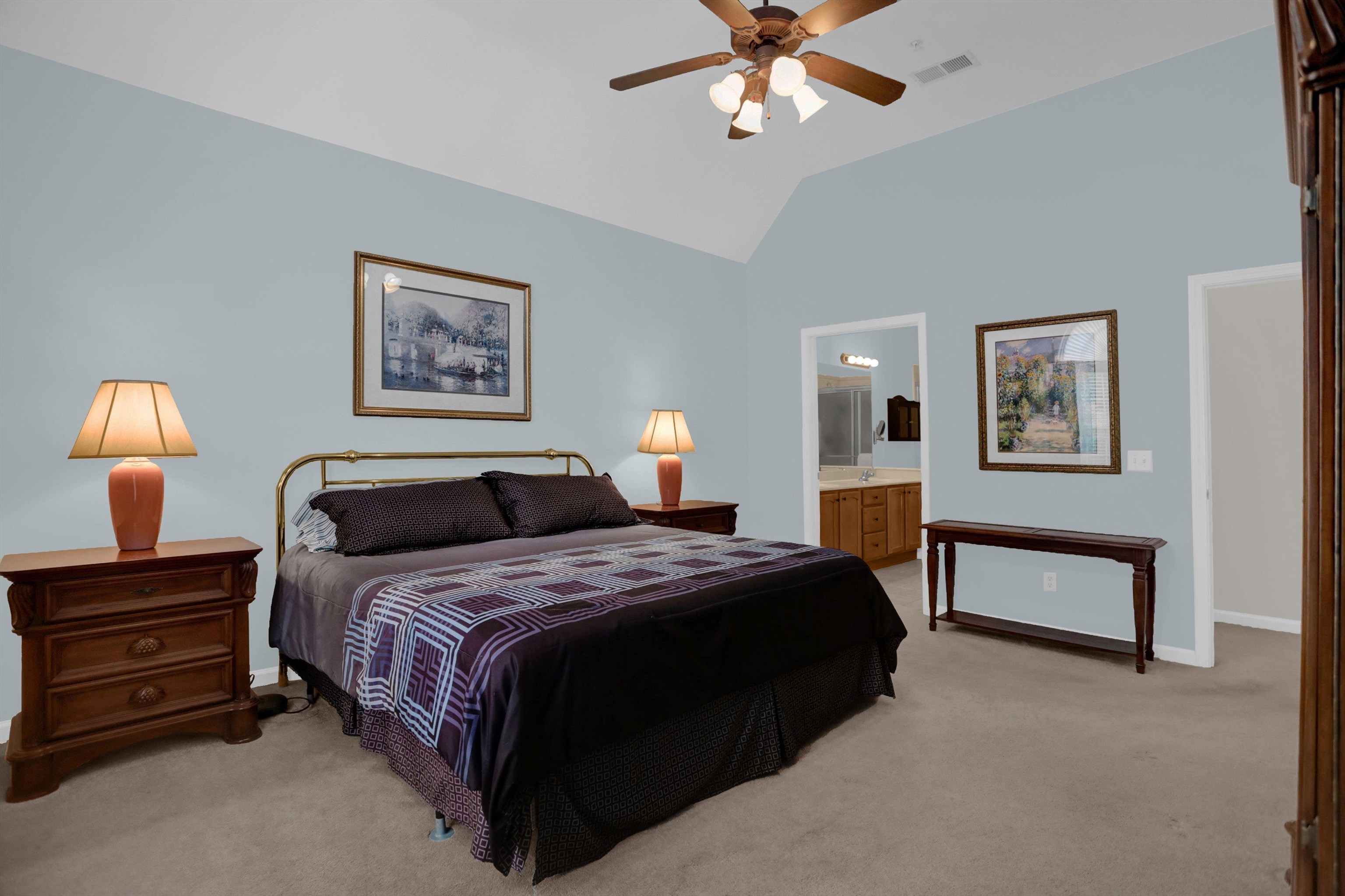 34 Peyton Ridge Drive, Unit 21 Collierville, TN 38017 - Photo 26 of 37 Spacious bedroom with vaulted ceilings, light blue wall paint, and beige carpeting