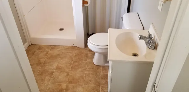 a bathroom with a sink and toilet