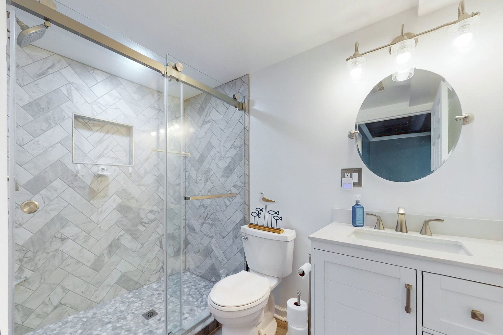 28986 Manitoba Trail McHenry, IL 60051 - Photo 21 of 44 a bathroom with a sink vanity mirror and toilet