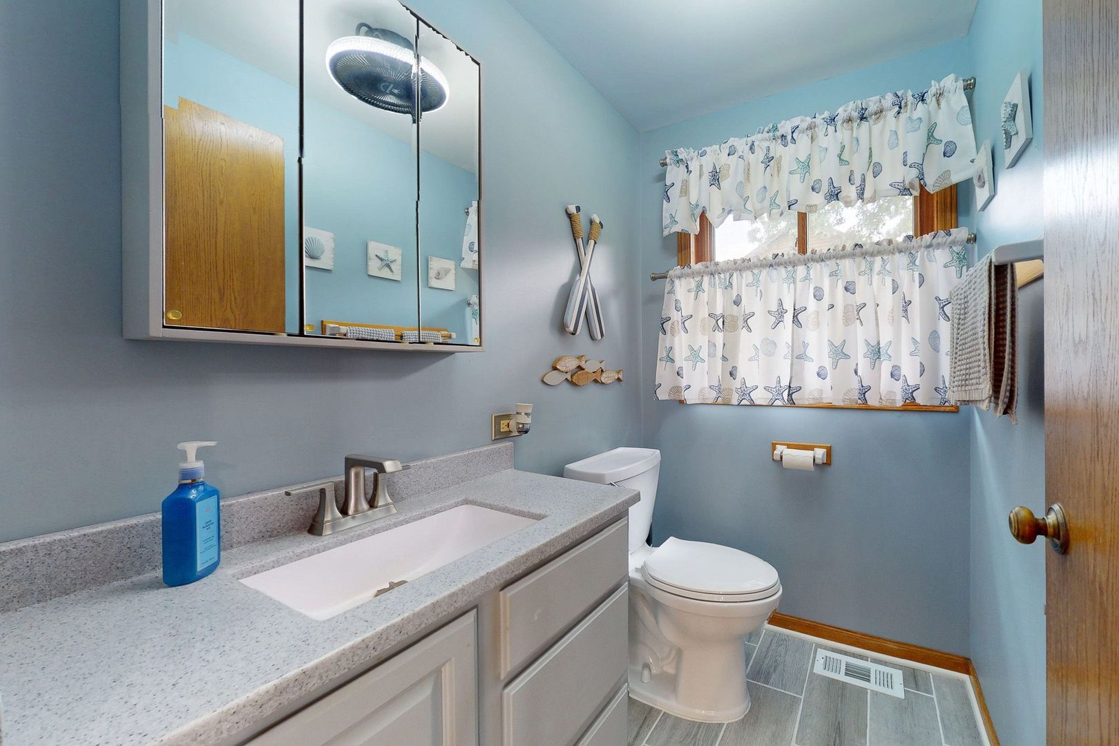 28986 Manitoba Trail McHenry, IL 60051 - Photo 9 of 44 a bathroom with a toilet sink and mirror