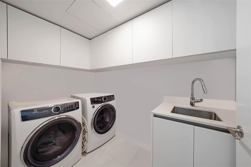 900 North Ocean Boulevard, Unit 906 Pompano Beach, FL 33062 - Photo 17 of 33 a utility room with dryer and washer