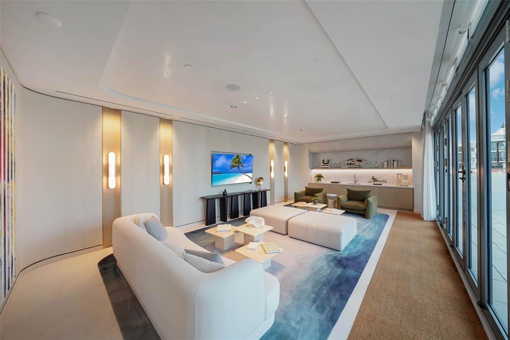 900 North Ocean Boulevard, Unit 906 Pompano Beach, FL 33062 - Photo 23 of 33 a large bedroom with a bed and a large window