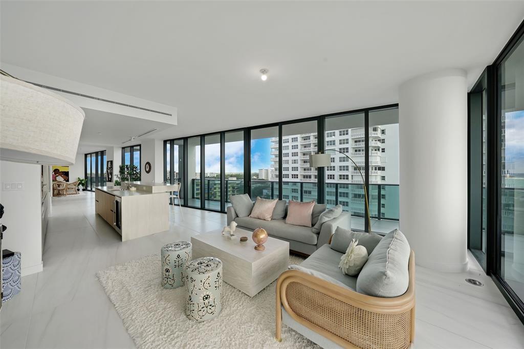 900 North Ocean Boulevard, Unit 906 Pompano Beach, FL 33062 - Photo 6 of 33 a living room with furniture and a large window