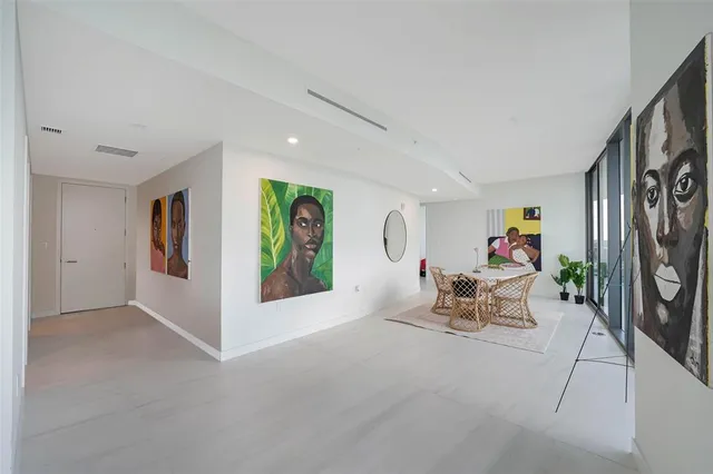 a bedroom with a large bed and a large window