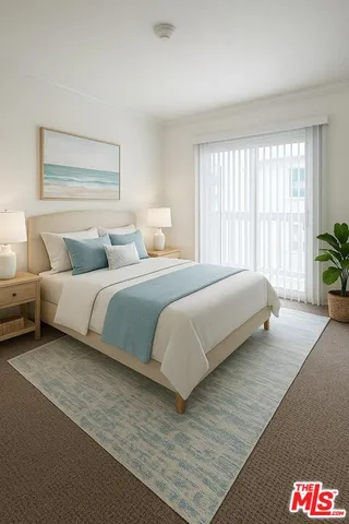 a bedroom with a bed and a large window