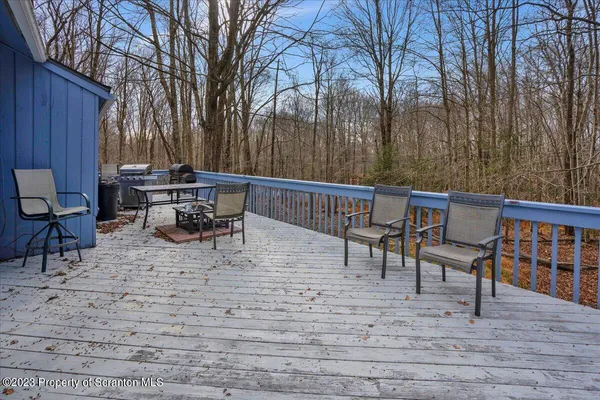 a view of a chairs and table on the patio