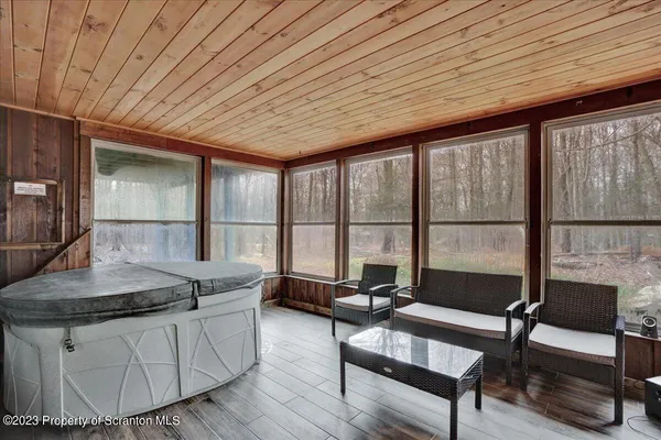 a living room with a table a couch and a table