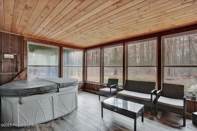 a living room with a table a couch and a table