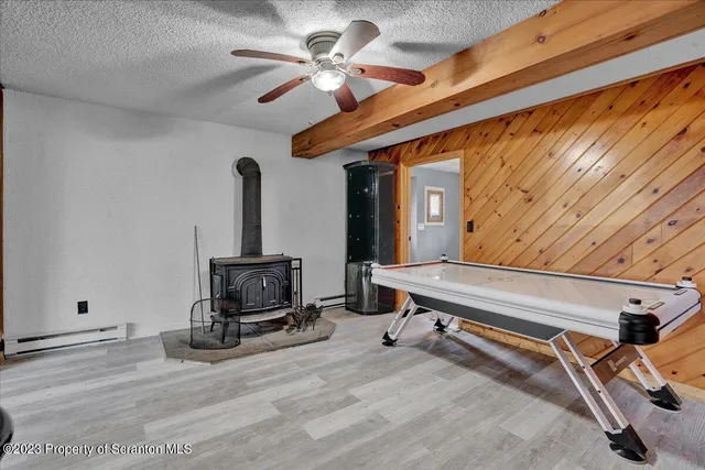 a living room with a flat screen tv and a window