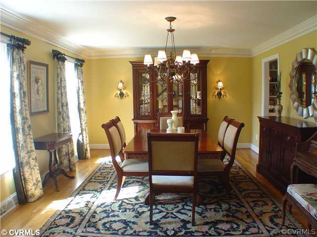 14430 Chepstow Road Midlothian, VA 23113 - Photo 6 of 20 a dining room with furniture a chandelier and wooden floor