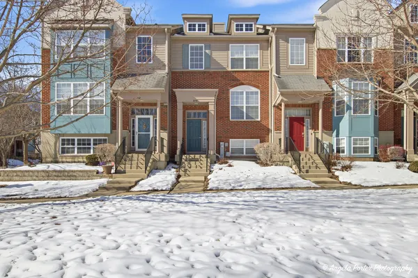 a view of a house with snow on the ground