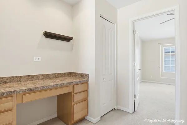 an empty room with a empty space and windows