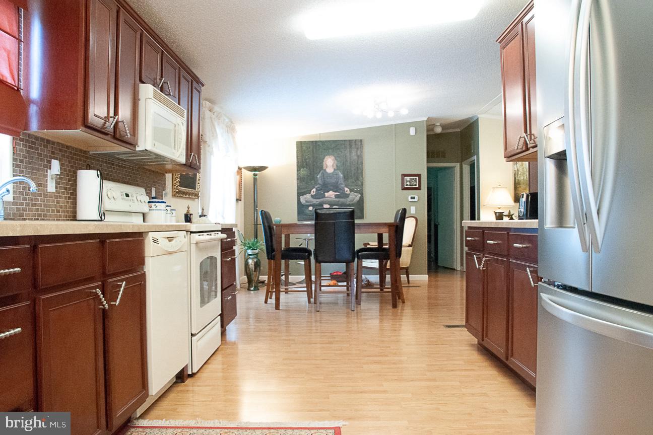 7899 Dublin Road Salisbury, MD 21801 - Photo 8 of 22 View of the dining room through the kitchen