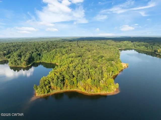 a view of a lake with a big yard