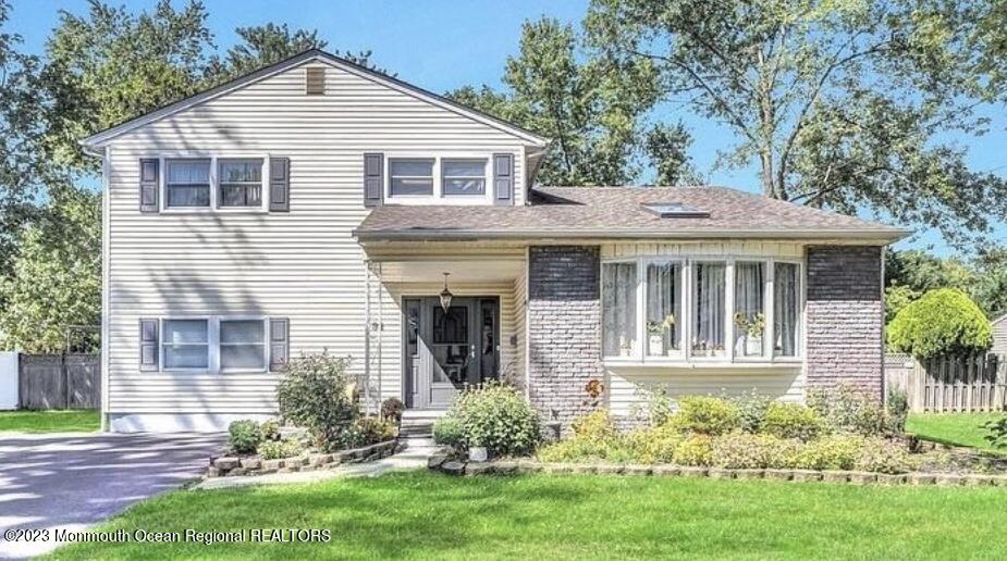 32 Eisele Avenue Asbury Park, NJ 07712 - Photo 1 of 16 a front view of a house with a yard