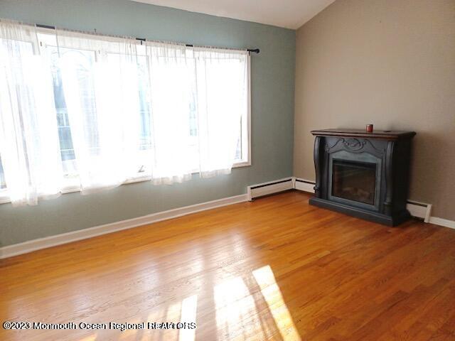 32 Eisele Avenue Asbury Park, NJ 07712 - Photo 14 of 16 a view of empty room with window and fireplace