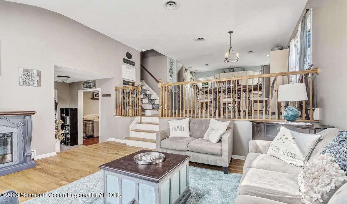 32 Eisele Avenue Asbury Park, NJ 07712 - Photo 5 of 16 a living room with furniture and a fireplace