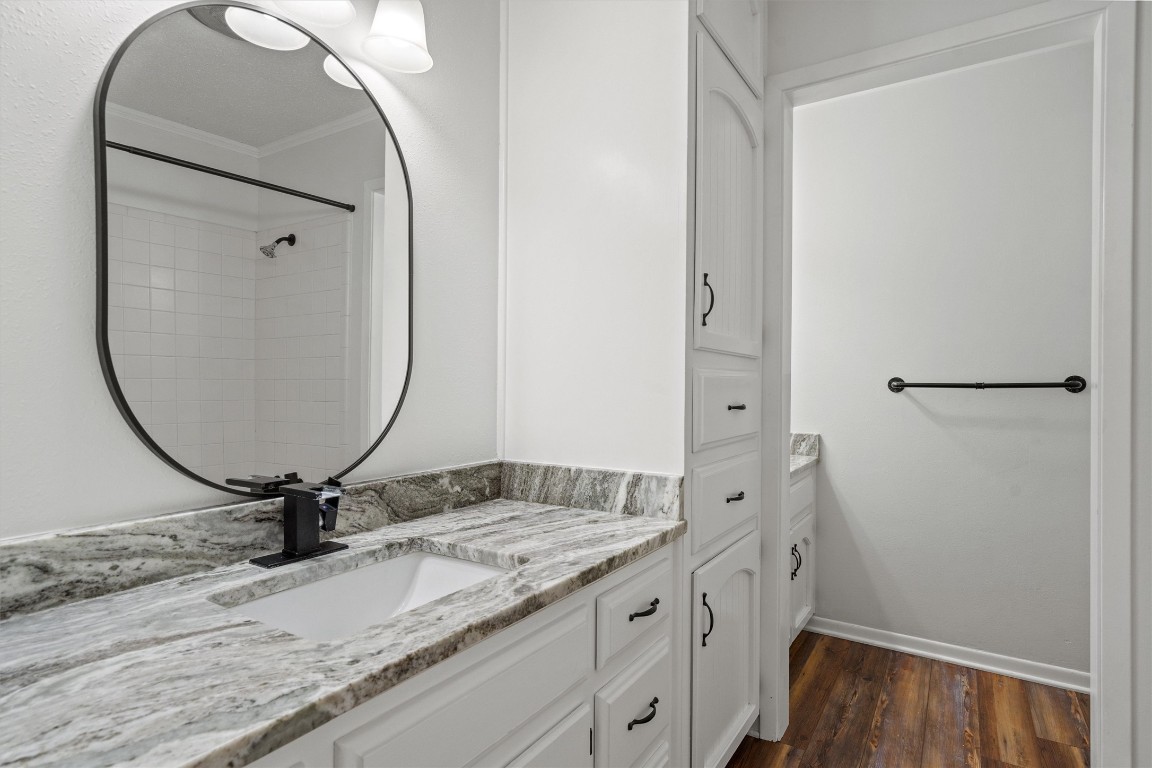 4101 Briar Cliff Road Temple, TX 76502 - Photo 25 of 40 a bathroom with a granite countertop sink and a mirror