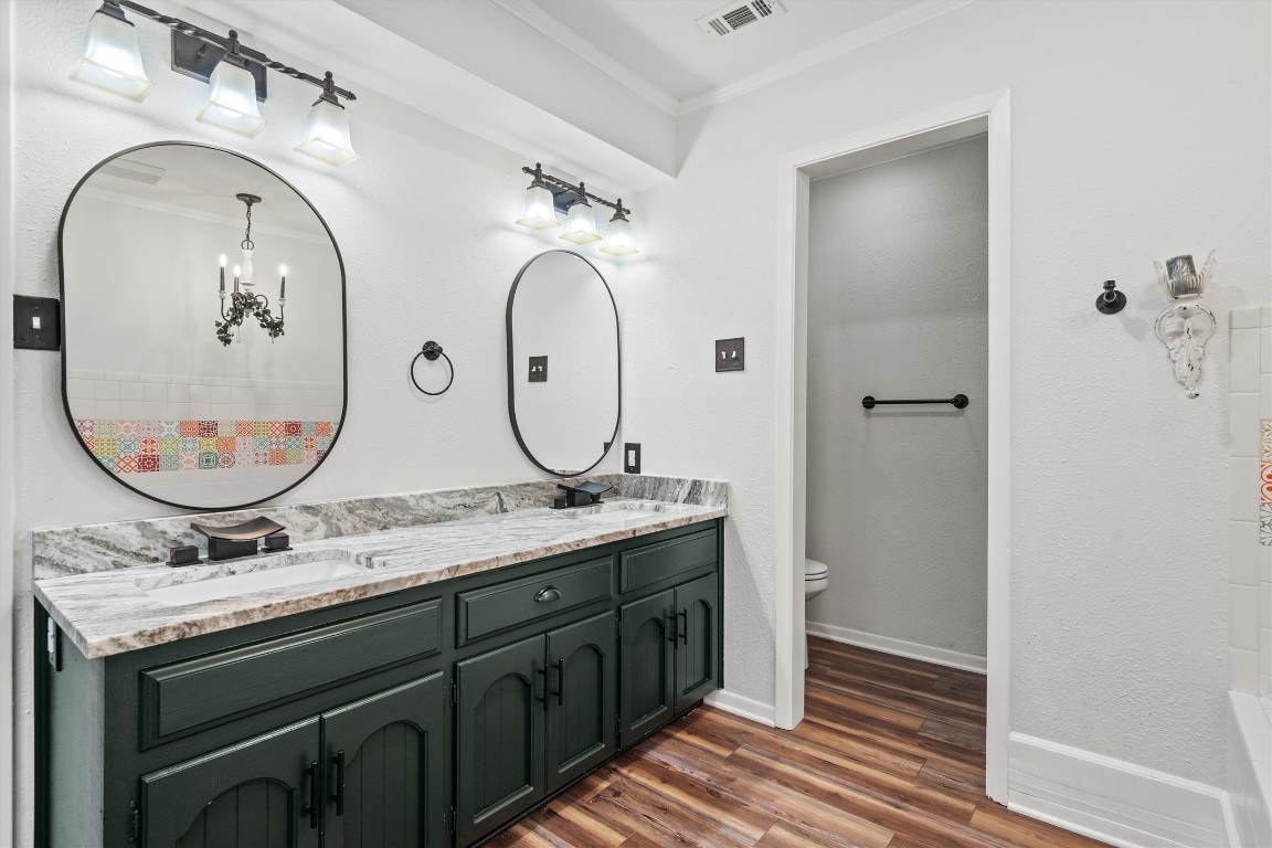 4101 Briar Cliff Road Temple, TX 76502 - Photo 30 of 40 a bathroom with a double vanity sink and a mirror