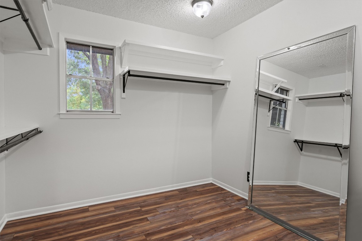 4101 Briar Cliff Road Temple, TX 76502 - Photo 33 of 40 a view of an empty room with wooden floor closet and a window