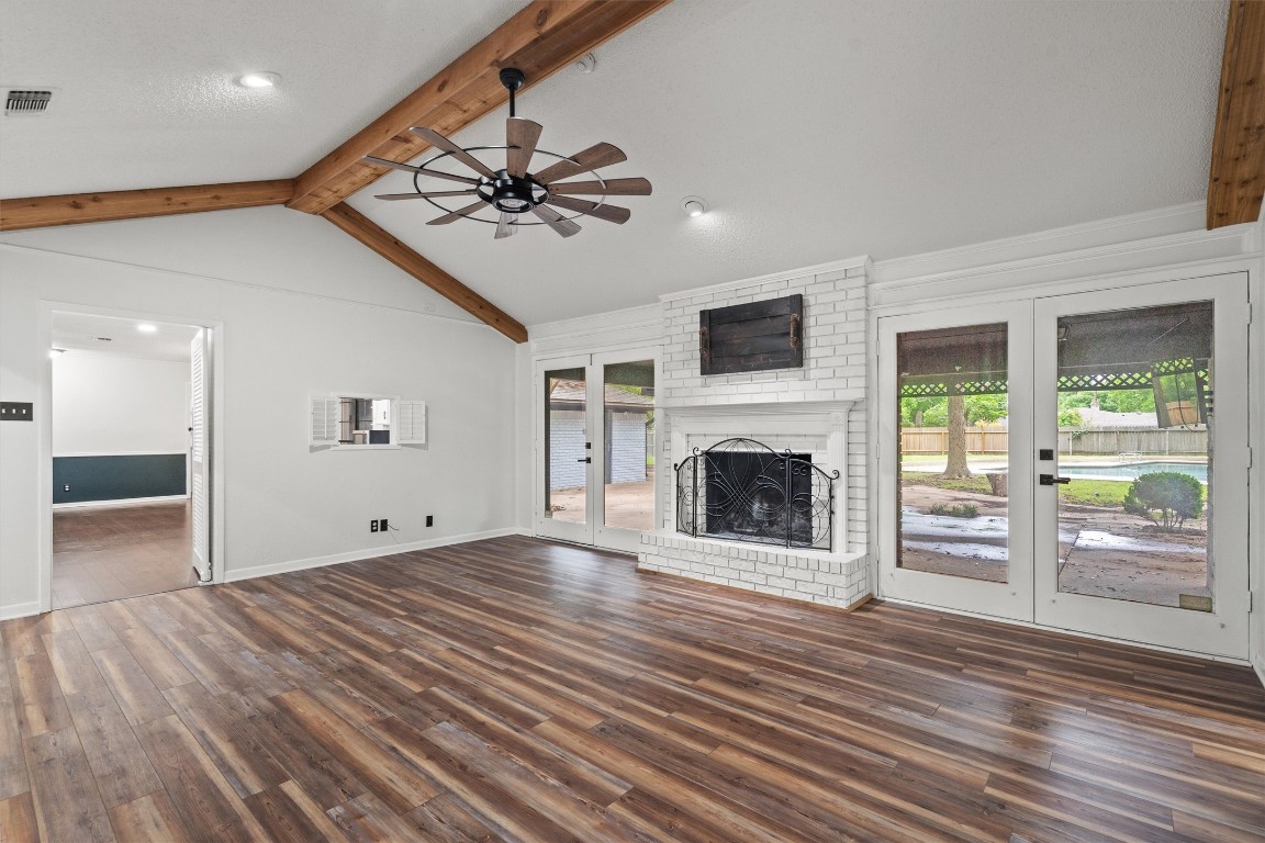 4101 Briar Cliff Road Temple, TX 76502 - Photo 6 of 40 a view of a livingroom with a fireplace a ceiling fan and entryway