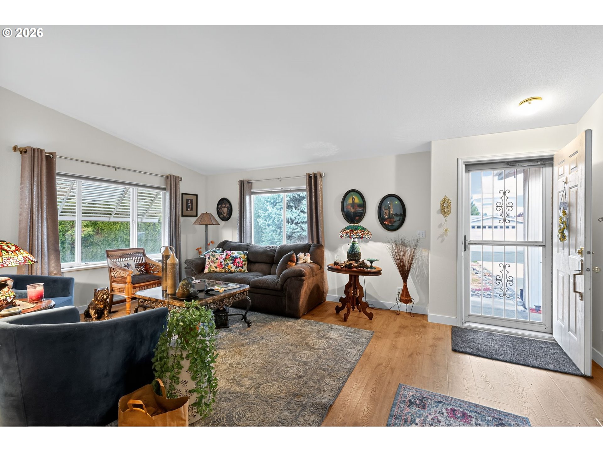 1620 Northeast 6th Street Redmond, OR 97756 - Photo 13 of 25 a living room with furniture and a large window