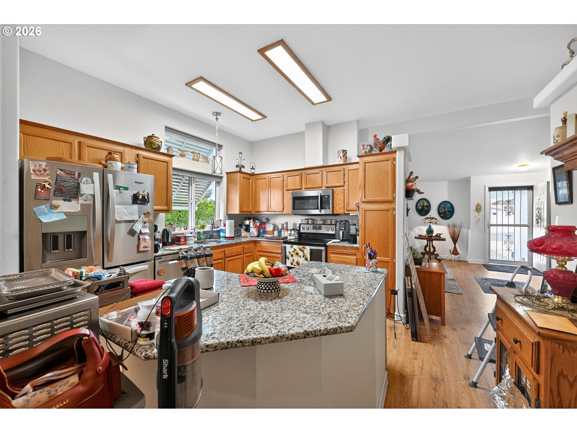 1620 Northeast 6th Street Redmond, OR 97756 - Photo 16 of 25 a kitchen view of a dining table chairs and refrigerator