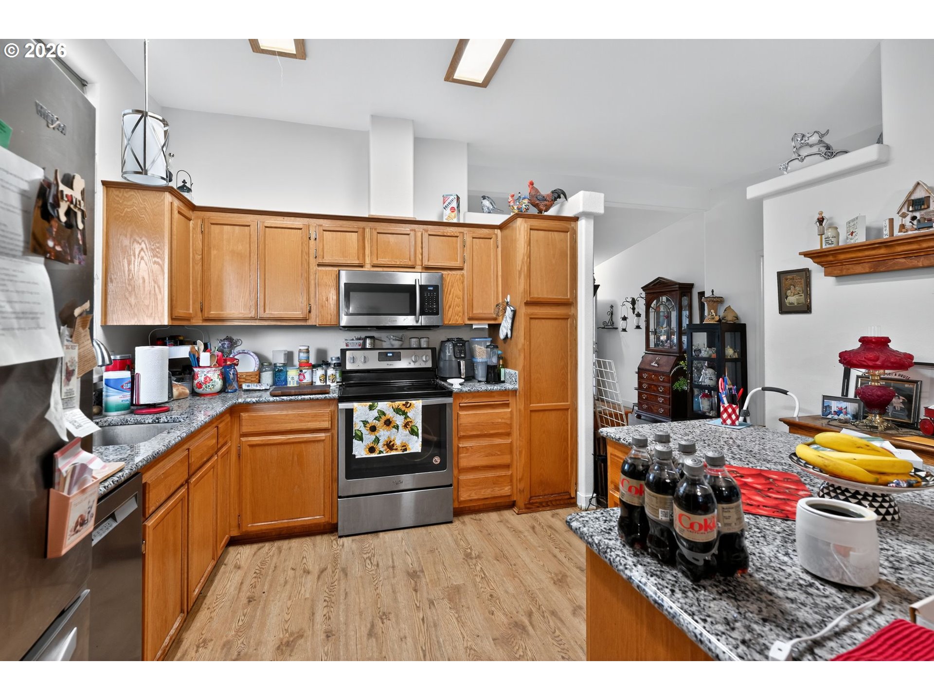 1620 Northeast 6th Street Redmond, OR 97756 - Photo 17 of 25 a kitchen with a refrigerator and a stove