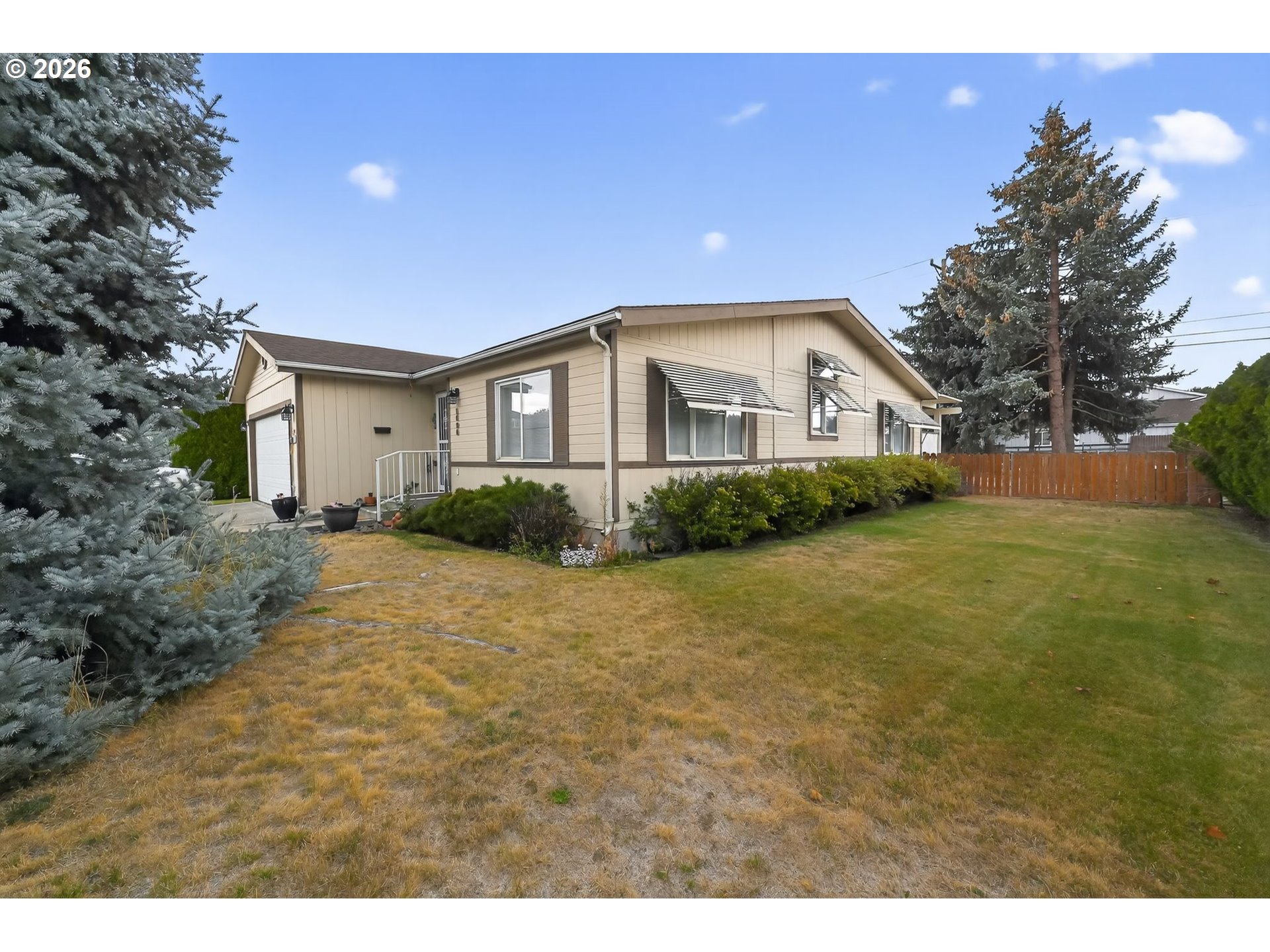 1620 Northeast 6th Street Redmond, OR 97756 - Photo 4 of 25 a front view of a house with a yard