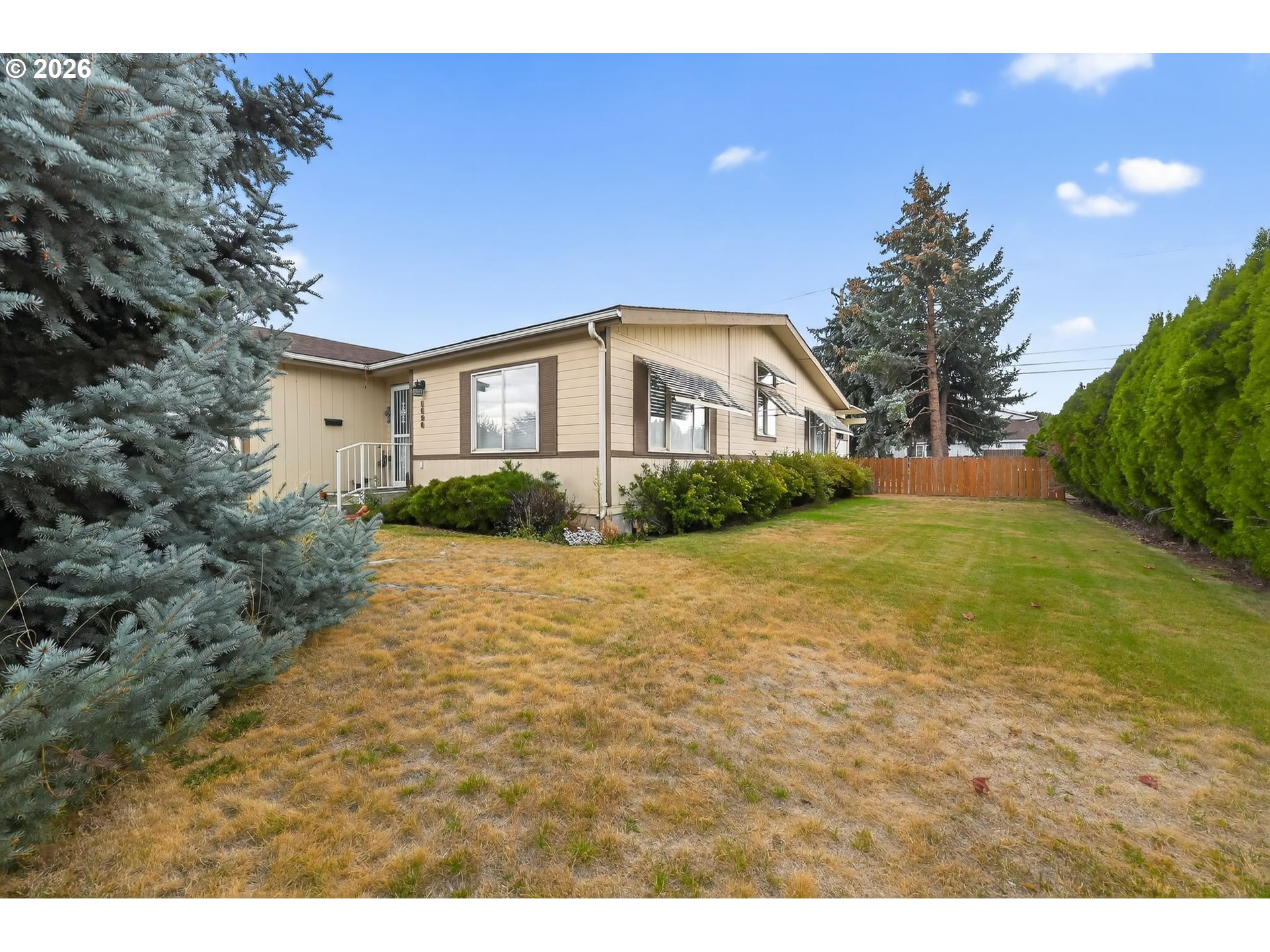 1620 Northeast 6th Street Redmond, OR 97756 - Photo 5 of 25 a front view of a house with a yard